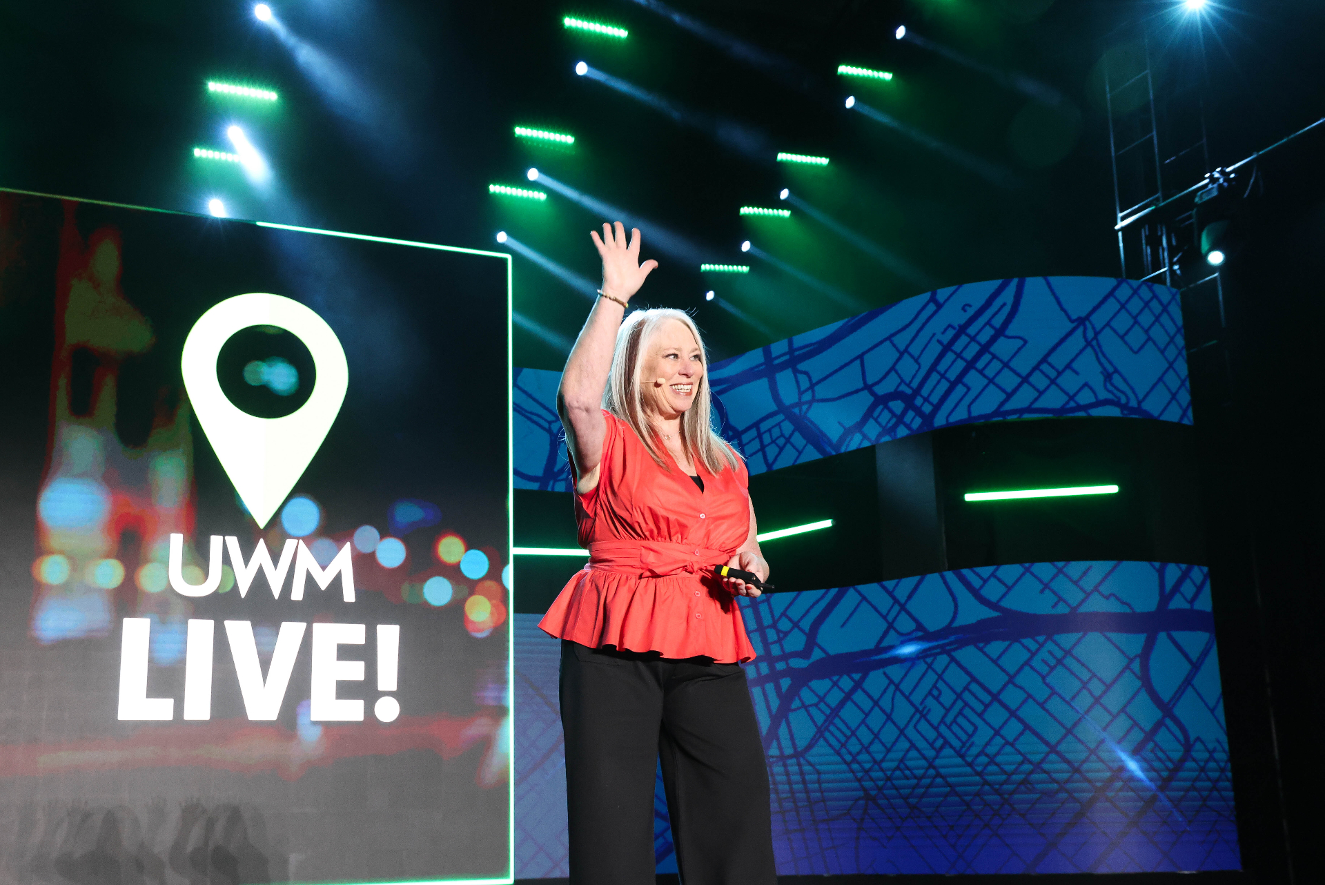 Kym Mason speaking on stage at UWM Live!